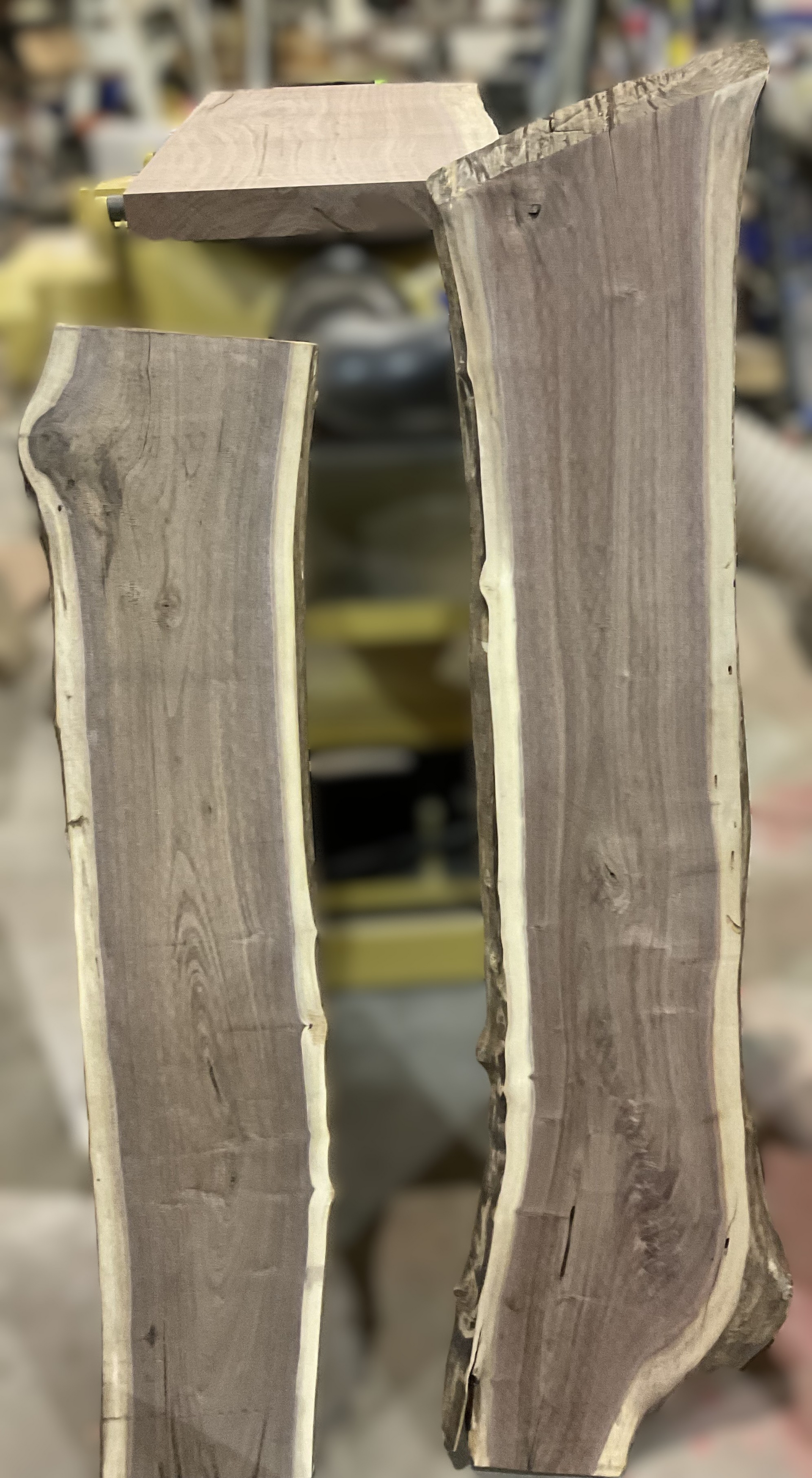 Two pieces of wood are sitting next to each other on a table.