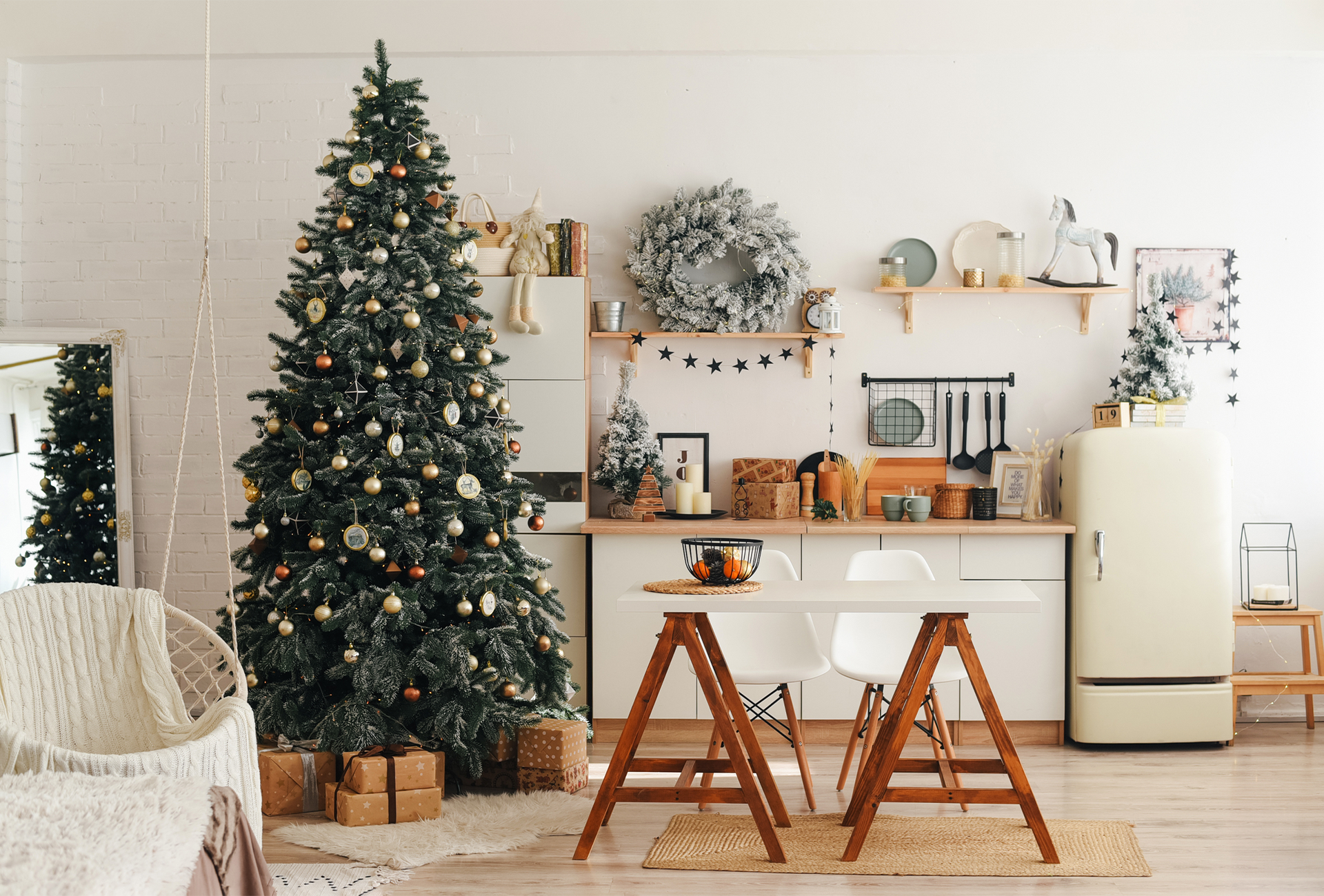 There is a christmas tree in the middle of the room