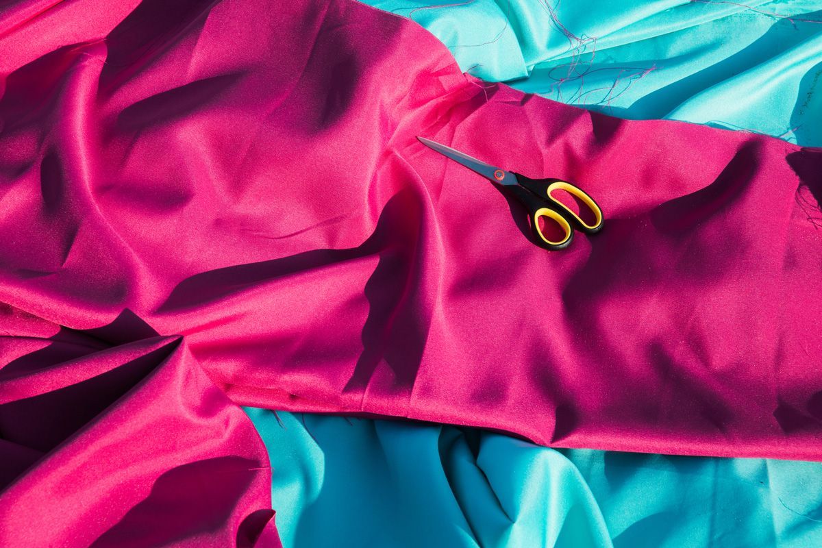 Scissors on the Bright Crimson Fabric — Indianapolis, IN — Phoenix Design Concepts