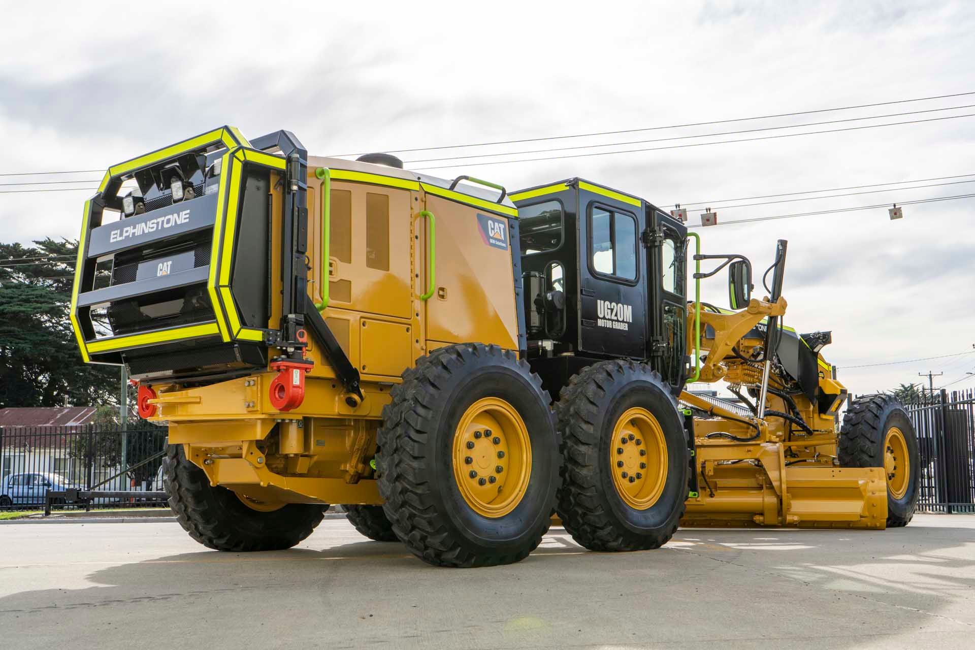 a yellow tractor with the word cat on it