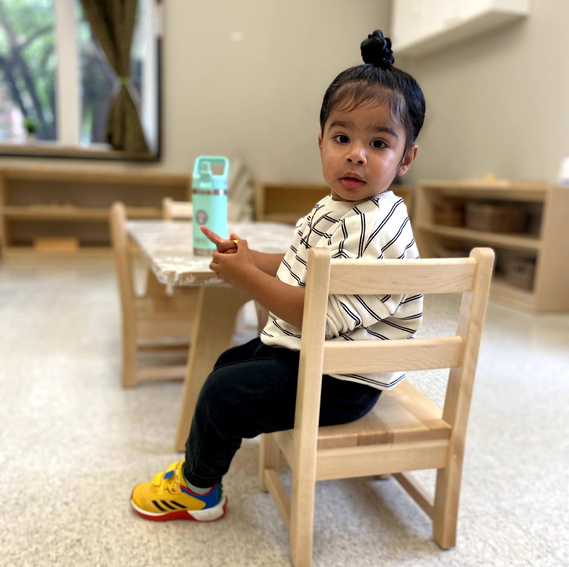 Montessori toddler during snack time 