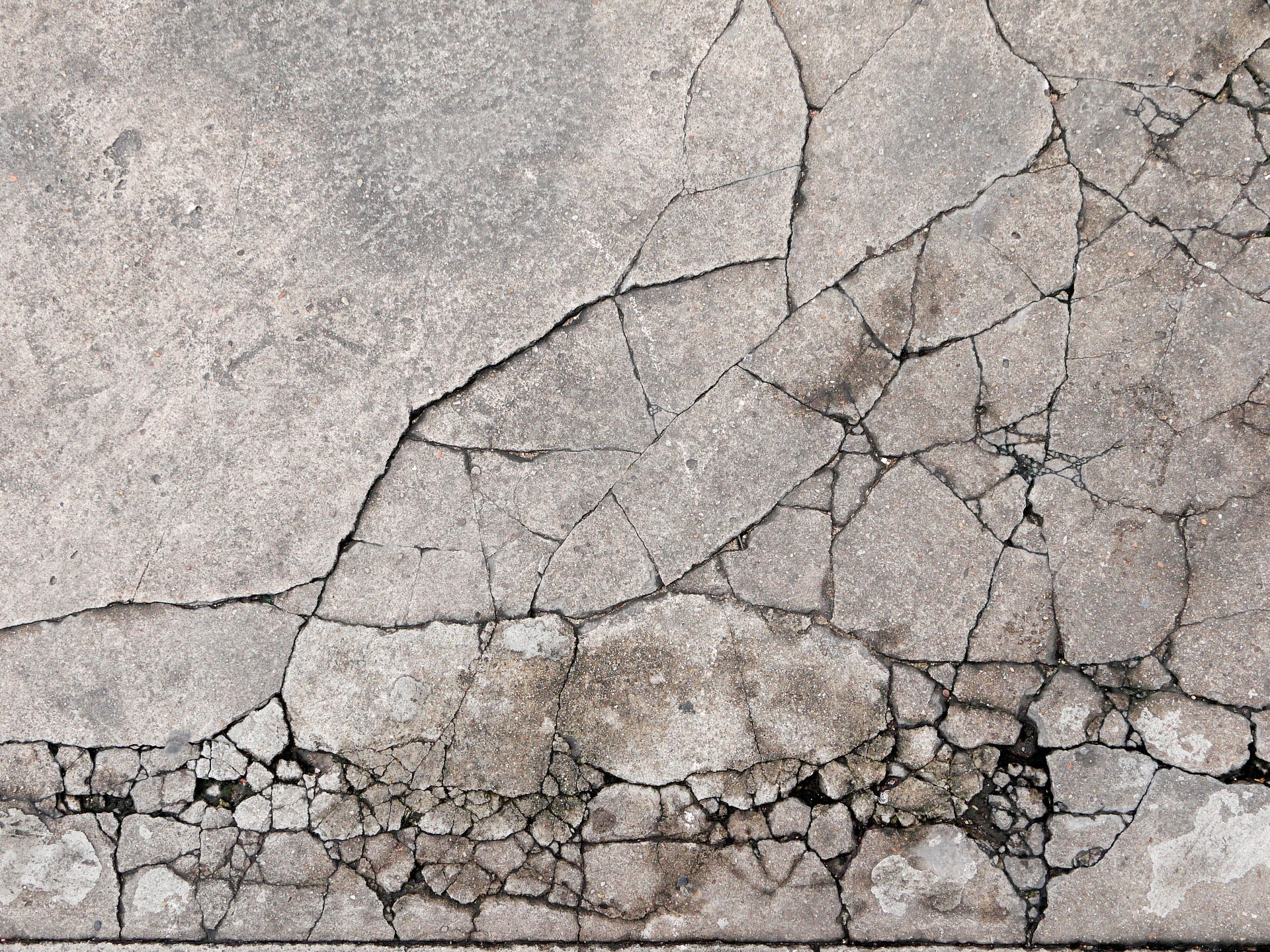 Cracks in concrete on aging driveway