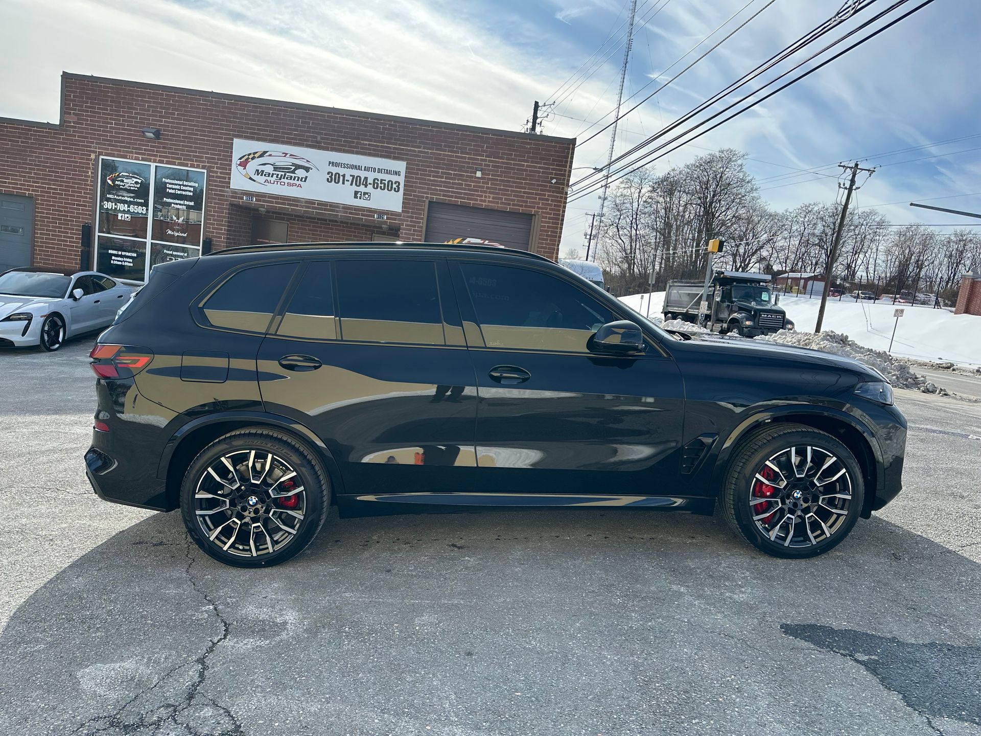 Ceramic coating being applied to a luxury vehicle at Maryland Auto Spa in Silver Spring MD