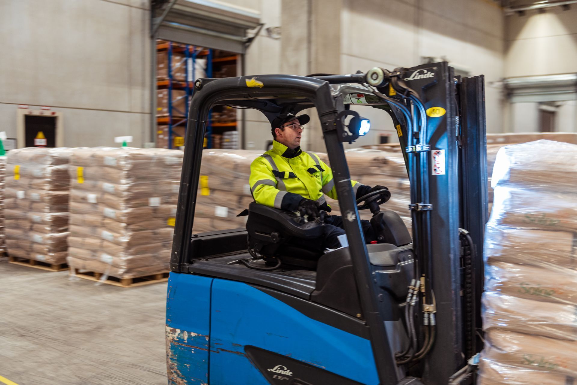 Forklift operator working in a warehouse  