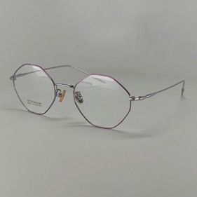 Silver-colored, octagonal-shaped eyeglasses with thin metal frames, set against a plain light gray background.