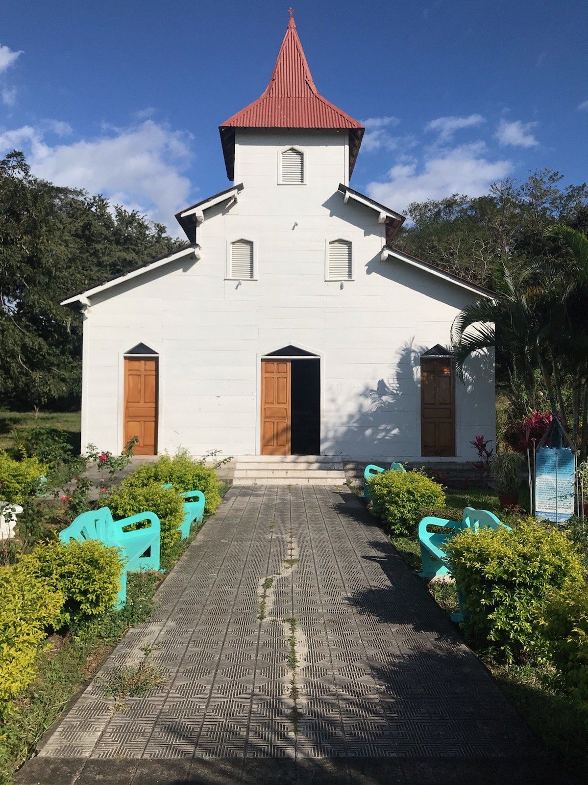 A small white church with a red roof