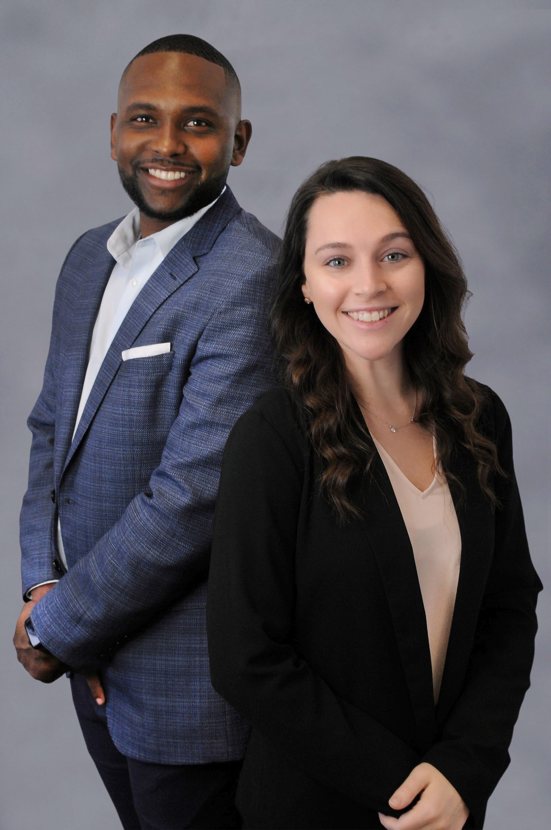 A man and a woman are posing for a picture together.