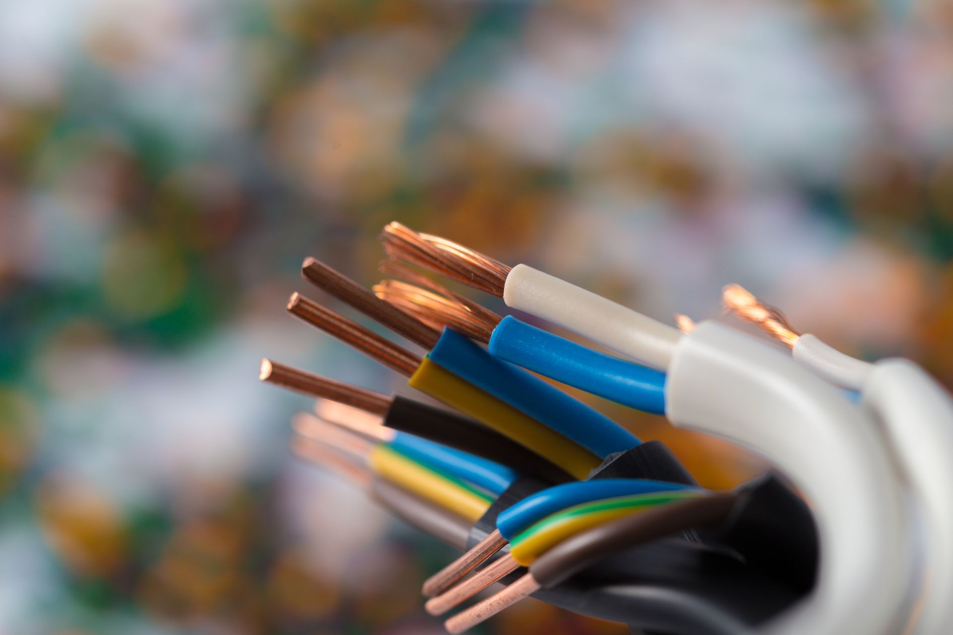 A bunch of electrical wires are stacked on top of each other.