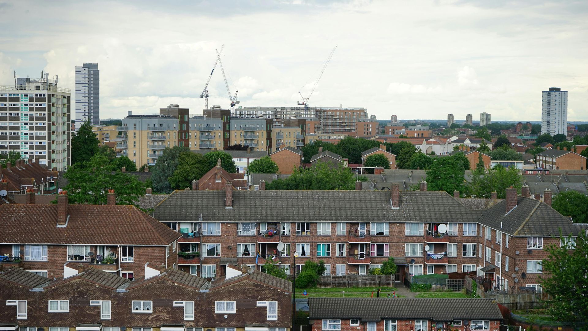 An aerial view of a city with lots of buildings and trees