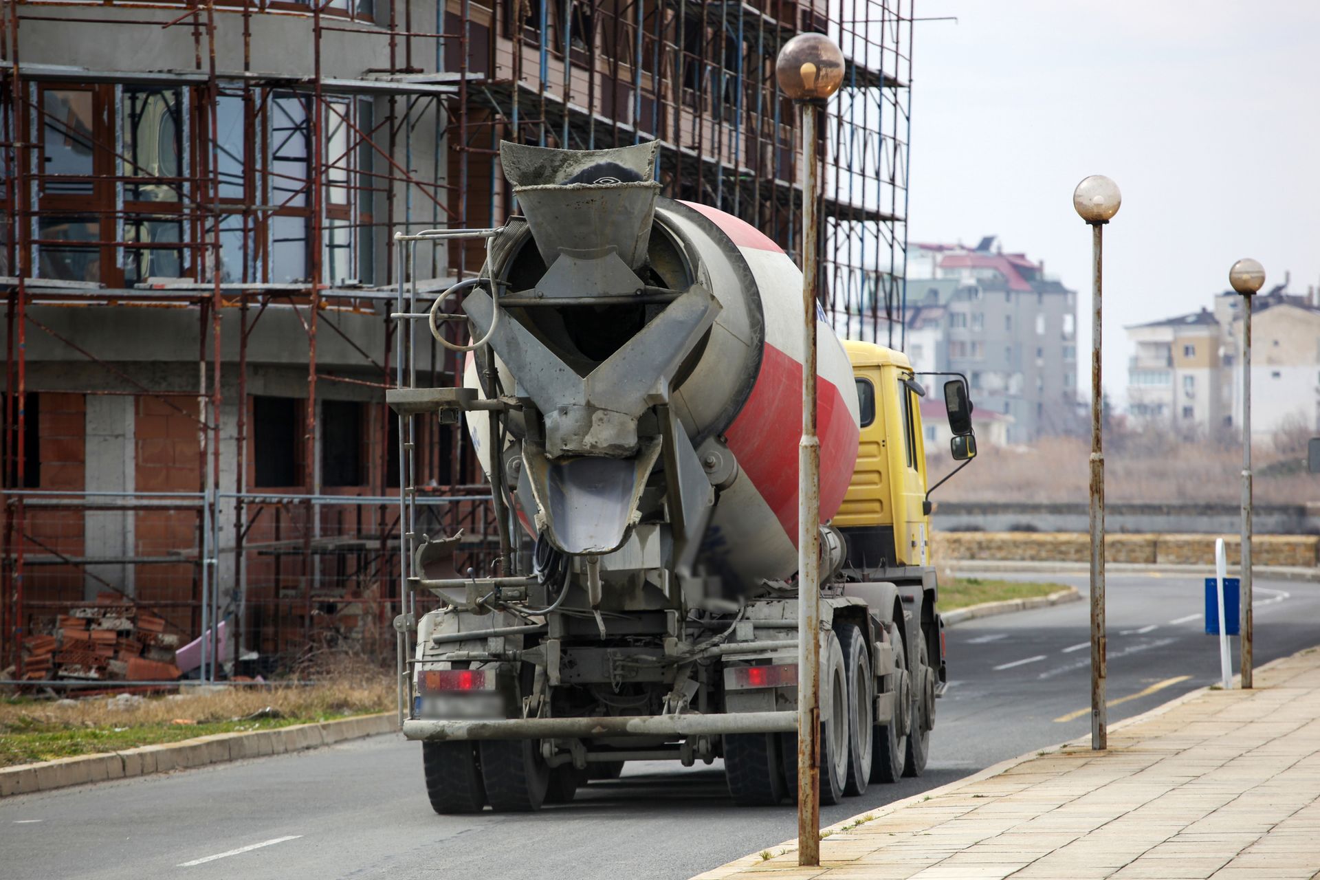 Concrete delivery in Portland, OR, by Troutdale Sand & Gravel Co., with a concrete truck on the road ensuring timely service.