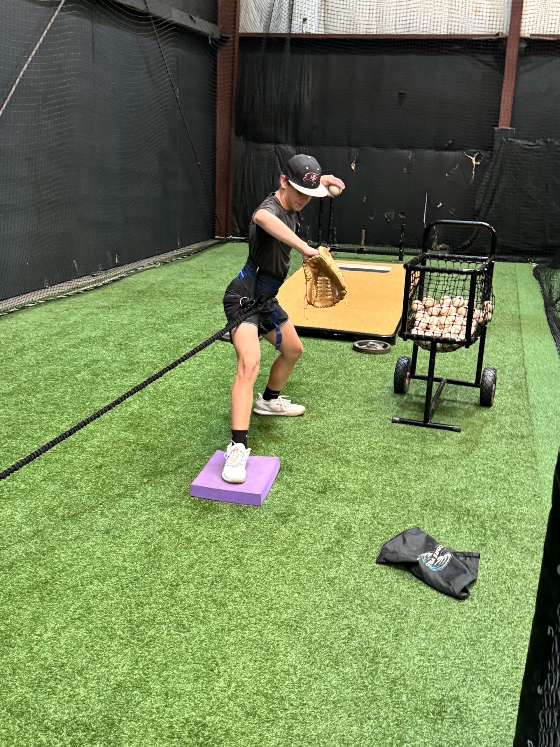 Pipeline Sports Performance coach running a private lesson inside the indoor facility