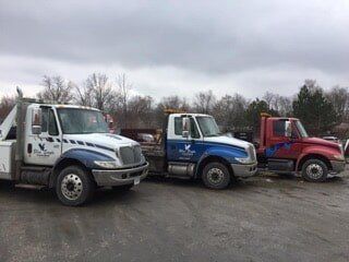 Three medium towing trucks in Bluffton, IN