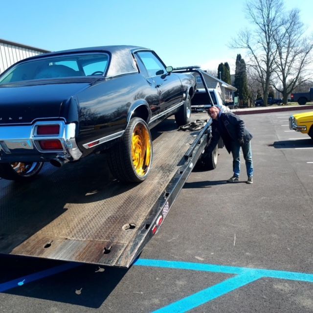 Black Car In the Towing Truck — Fort Wayne, IN — Blue Eagle Towing