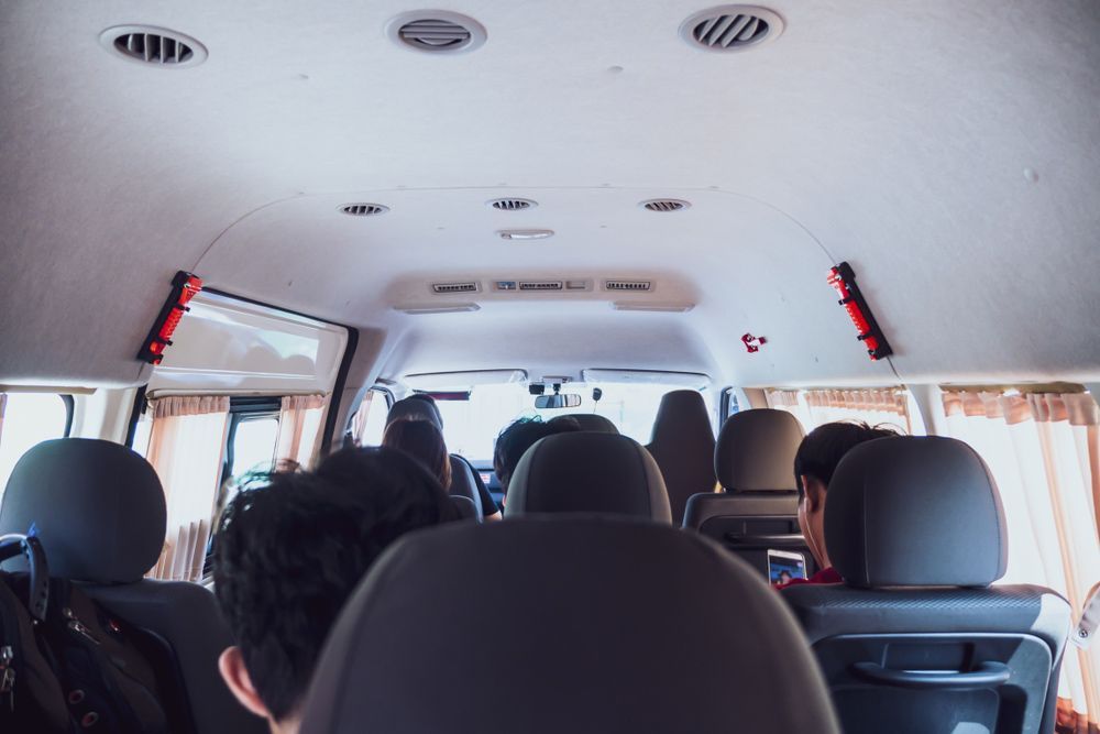 A Group of People Are Sitting in The Back of A Van — G & D Ross Bus Charters In Montville, QLD
