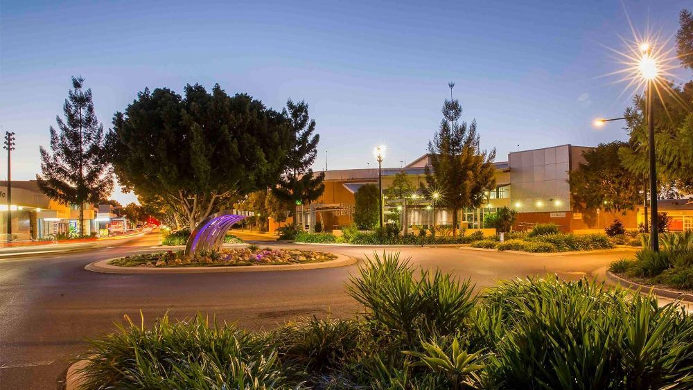 A Circular Driveway with Trees and Bushes — G & D Ross Bus Charters In Emerald, QLD