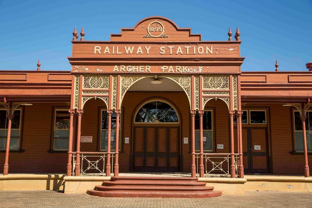 A Brick Building with A Sign that Says Railway Station — G & D Ross Bus Charters In Rockhampton, QLD