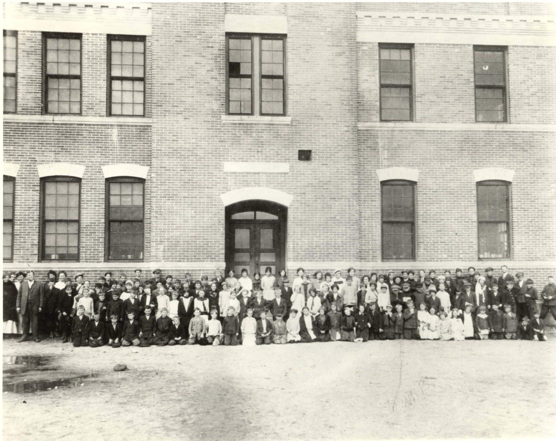 people-out-front-of-brick-building