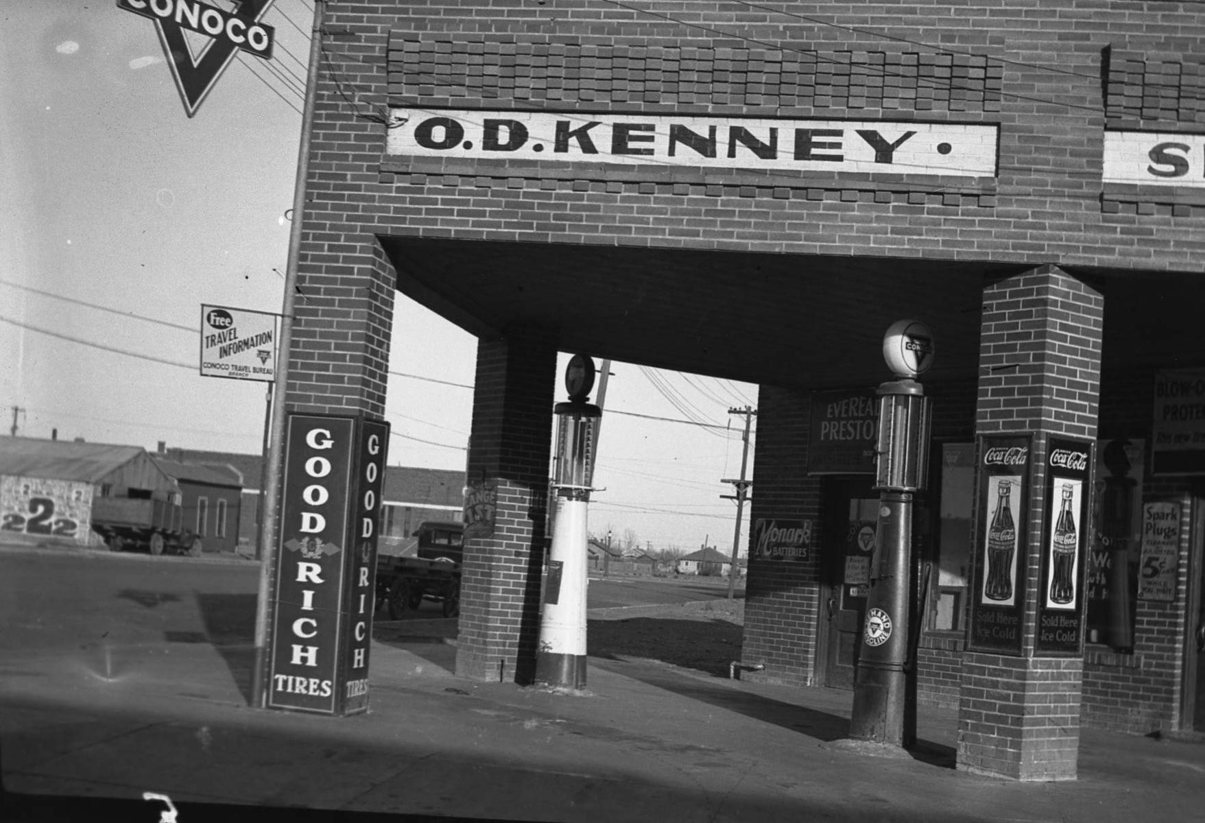 A black and white photo of a gas station called o.d. kenney