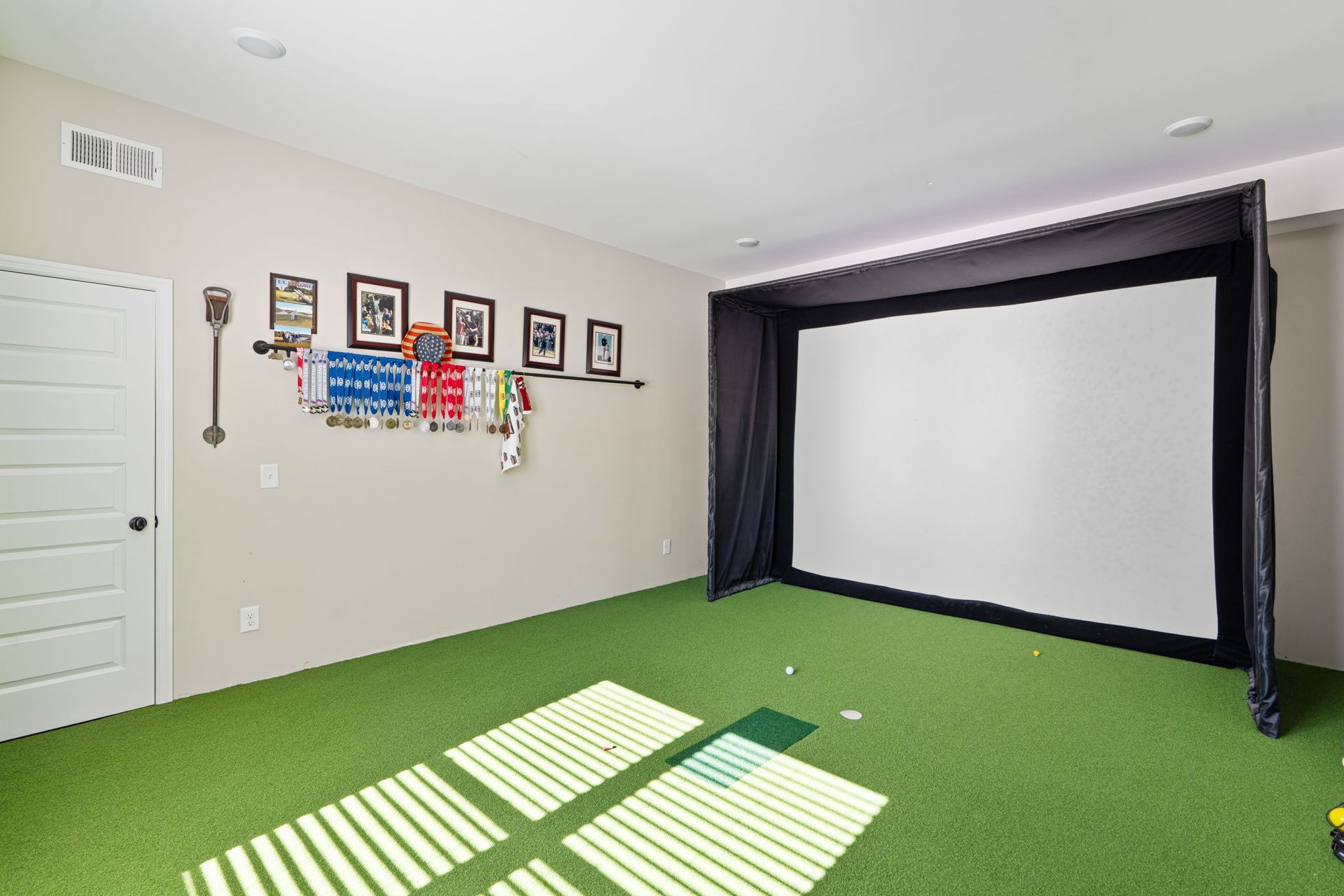 There is a large screen in the middle of the room.