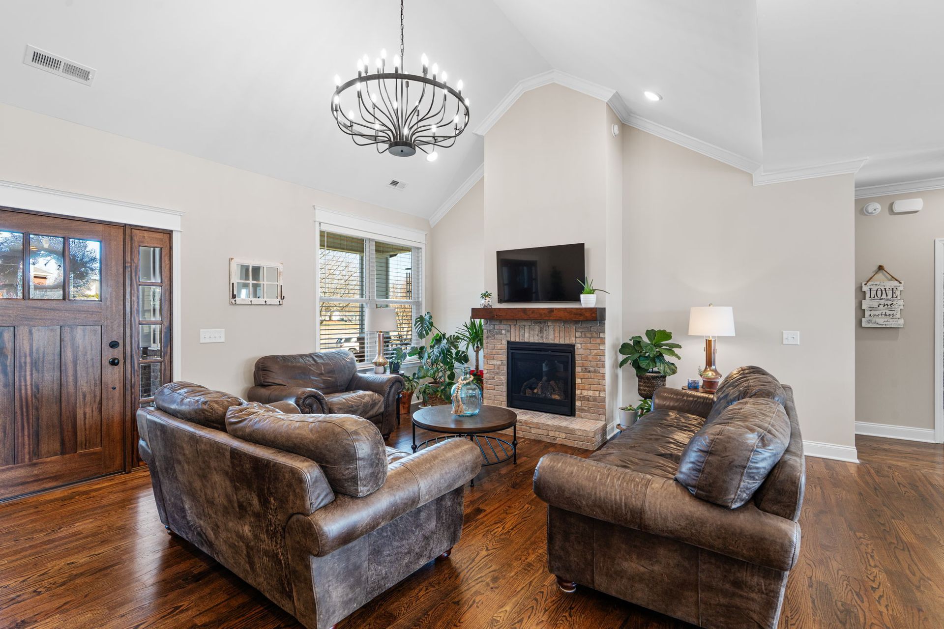 A living room filled with furniture and a fireplace.