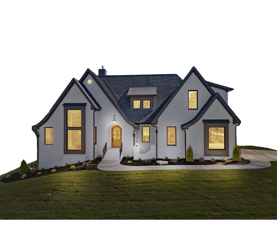 A white house with a black roof and a black garage door.