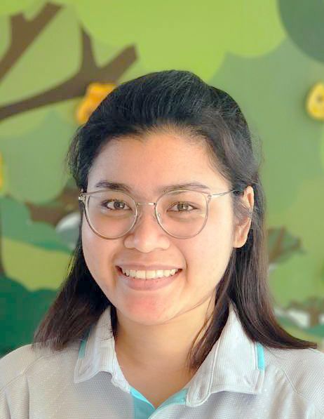 Ms Thansiri Tochaeng Toey, The woman is wearing glasses and smiling for the camera.