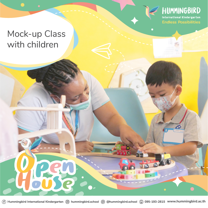 A woman is teaching a child how to play with toys at an open house.