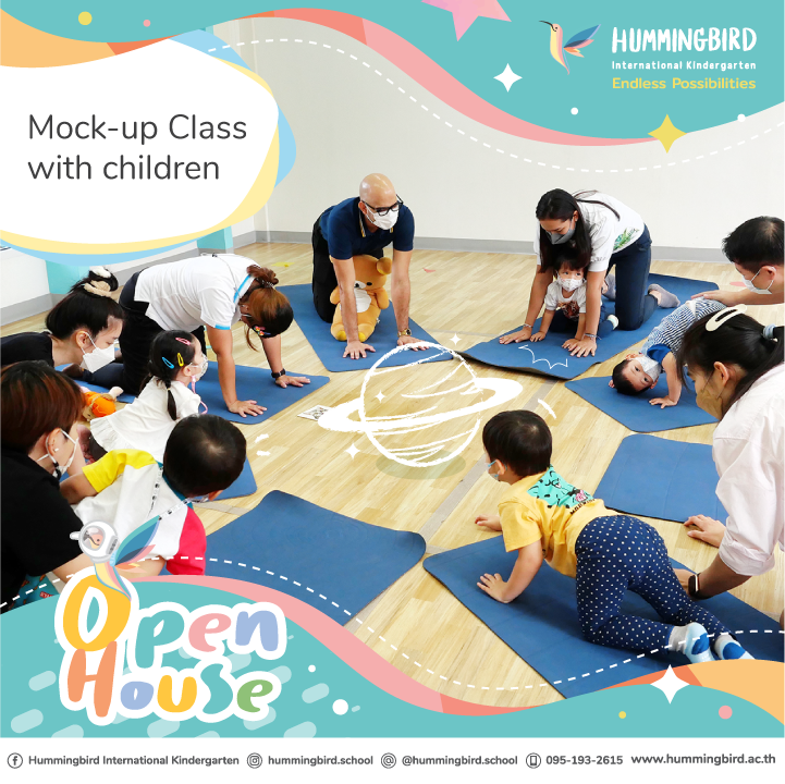 A group of people are sitting on yoga mats in a circle.