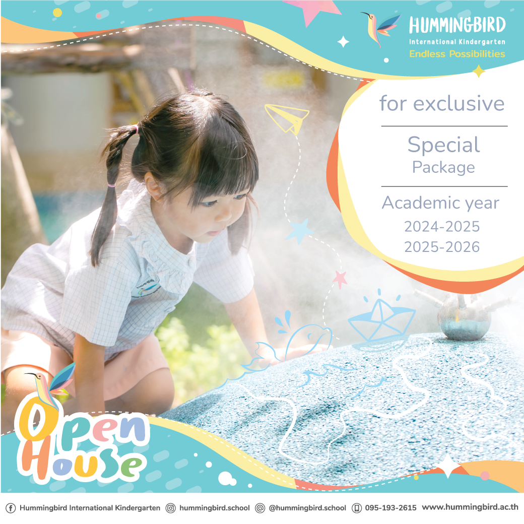 A little girl is crawling on a pile of sand.