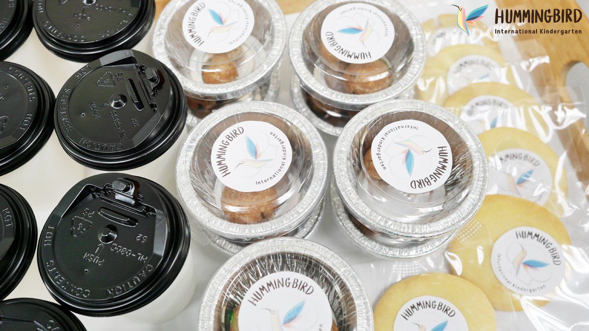 A bunch of cups of food are sitting on top of each other on a table.