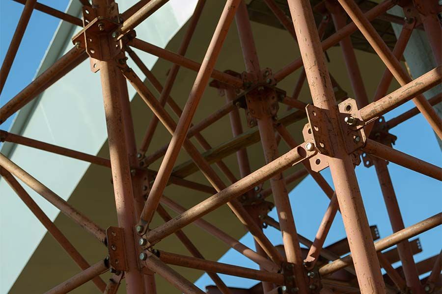 Looking up at a Metal Structure with a blue sky in the Background — Scaffolding Services in Gympie