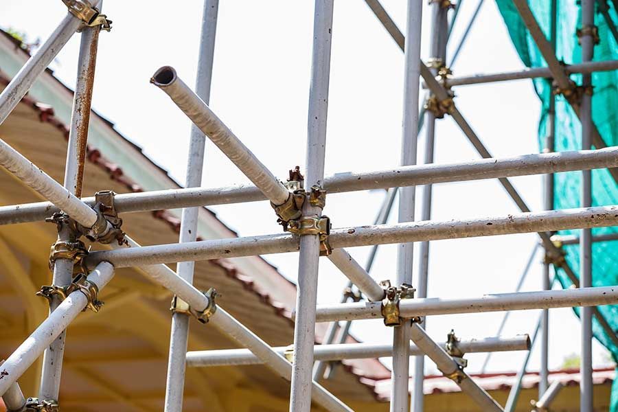A Close up of a Metal Scaffolding on top of a Building — Scaffolding Services in Gympie