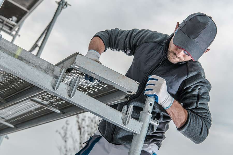 Man Working on A Scaffolding — Scaffolding Services in Gympie