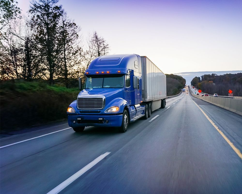 Blue Truck on Highway — Worthington, MN — Schaap Moving & Storage