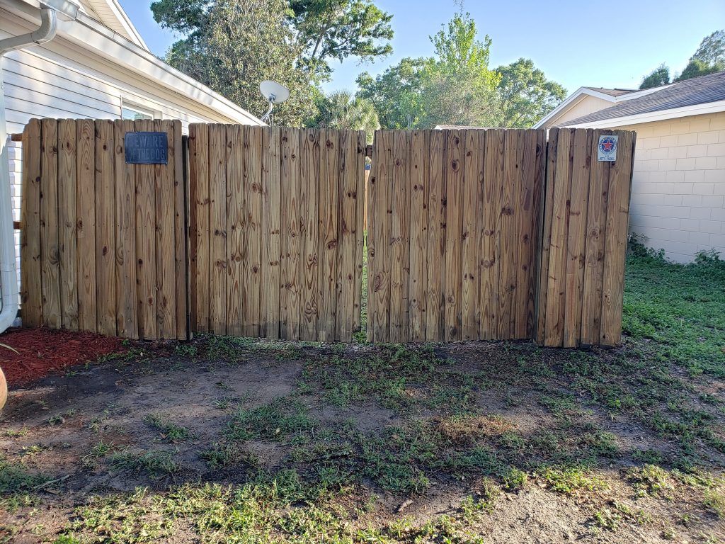 Wooden fence pressure washing — Apollo Beach, FL — EGA Parking Lot Striping & Pressure Washing