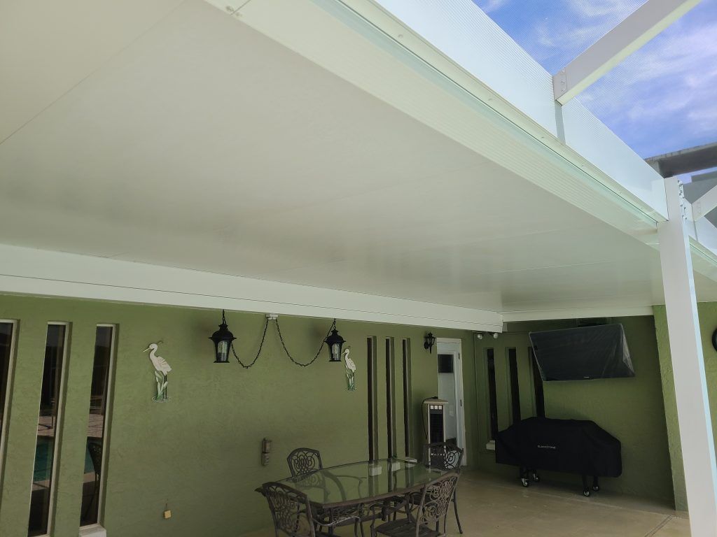Pool enclosure with table and chairs — Apollo Beach, FL — EGA Parking Lot Striping & Pressure Washing