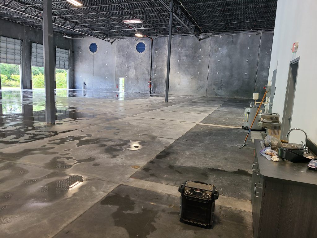 Warehouse after pressure washing — Apollo Beach, FL — EGA Parking Lot Striping & Pressure Washing