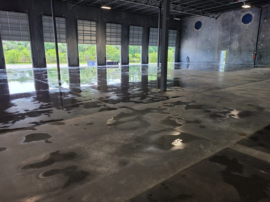 Warehouse pressure washing — Apollo Beach, FL — EGA Parking Lot Striping & Pressure Washing