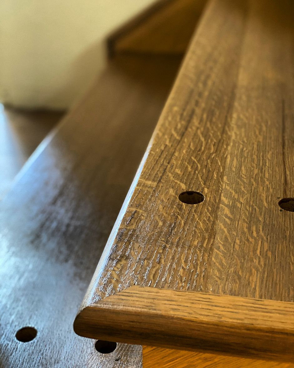 A close up of a piece of wood with holes in it