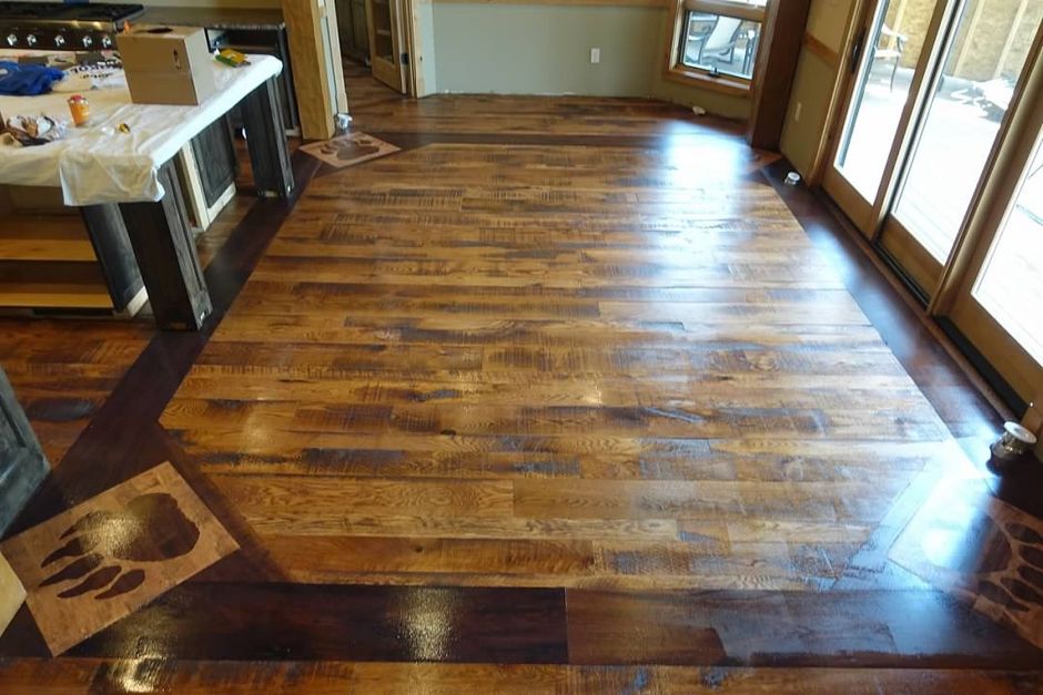 A room with a wooden floor and sliding glass doors