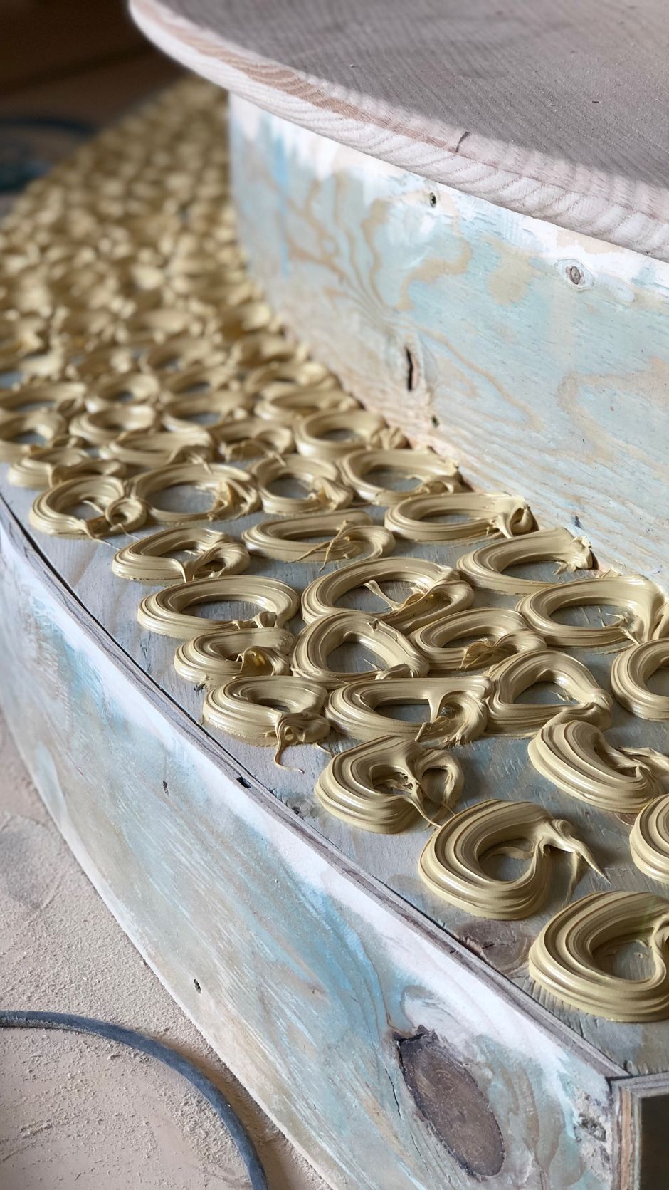 A bunch of pretzels are sitting on top of a wooden table.