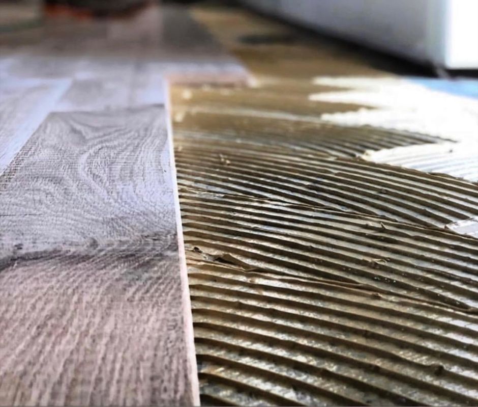 A close up of a wooden floor being installed.