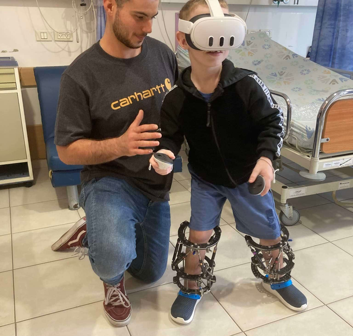 A man and a woman are playing with a little girl