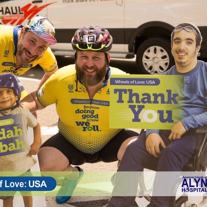 A group of people holding a thank you sign
