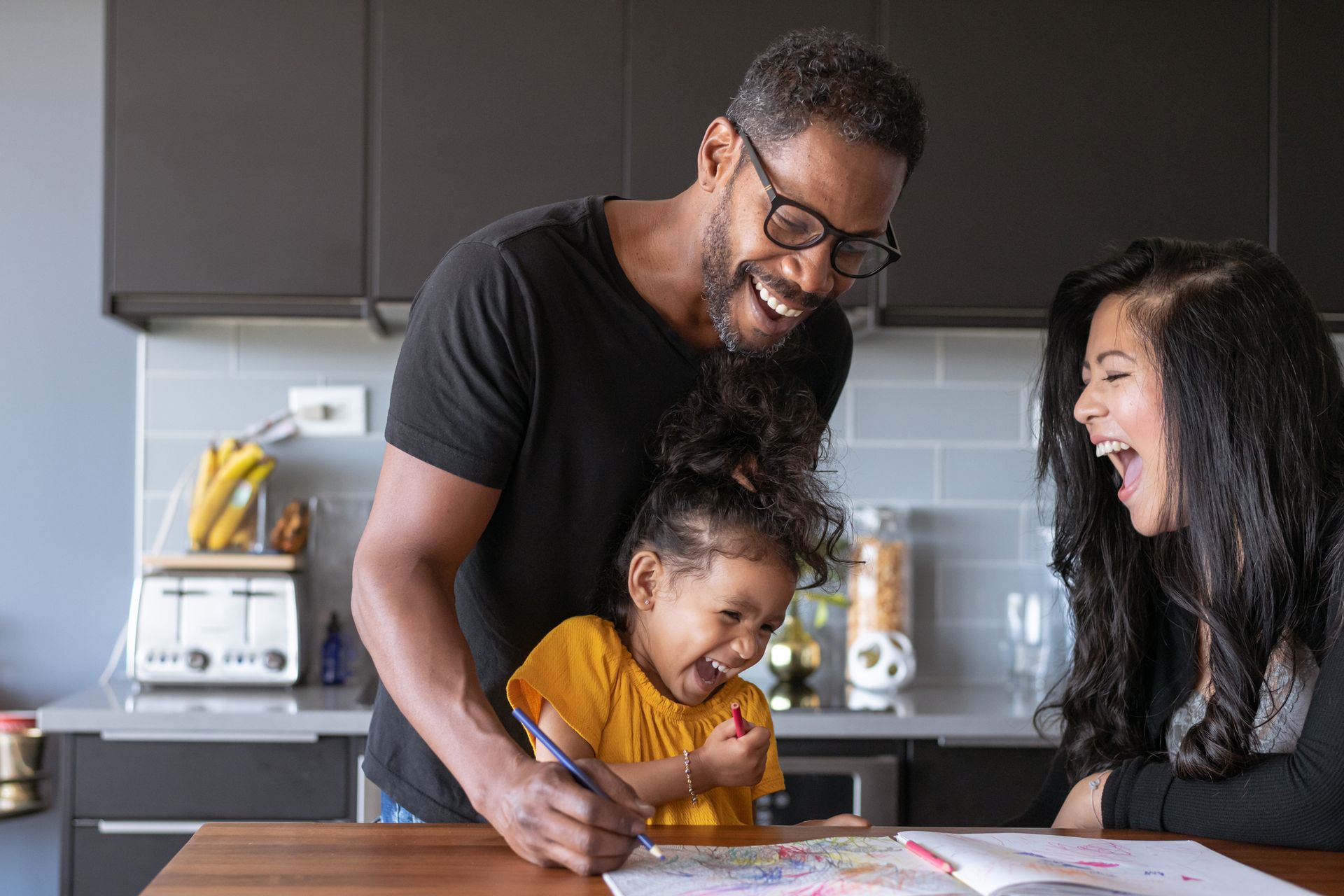 parents and daughter in kitchen