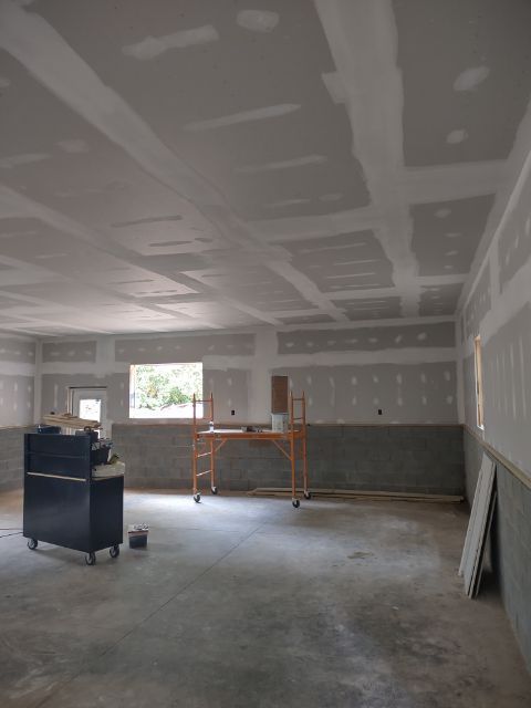 Professional Worker Finishing Drywall