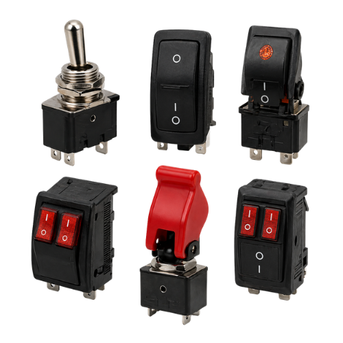 Assorted black and red toggle and rocker switches on a white background