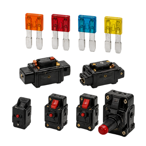 Assorted automotive blade and circuit breakers in orange, red, blue, yellow, and black with reset buttons