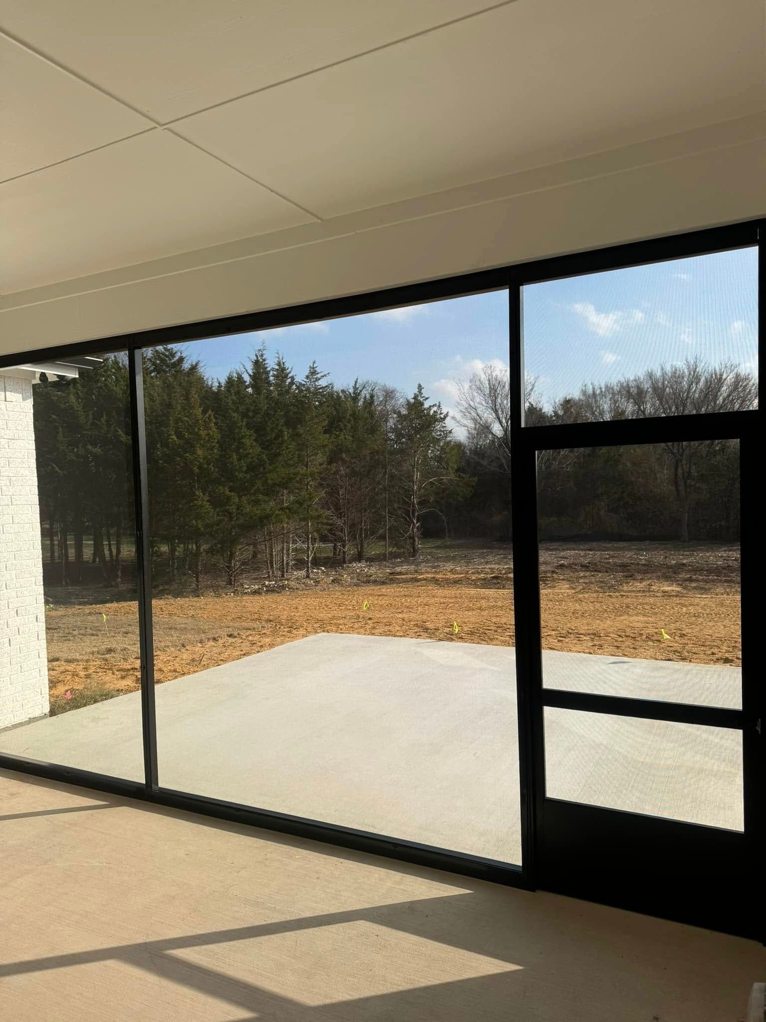 A room with a lot of windows and a door