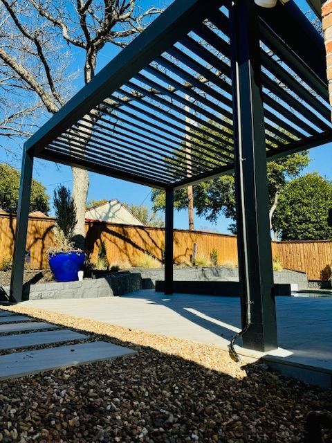 A pergola with a blue pot in the background